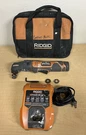 Ridgid Power Multi Tool R8223400 With Attachment, Charger, And Battery. Fixed Price $89.00.