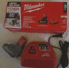 Milwaukee M12 Lithium-ion Battery Charger, Red, 48-59-2450B. Fixed Price $150.00.