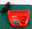 Milwaukee M12 Battery Charger 12V Red Single Bay Only 48-59-2401. Fixed Price $9.98.