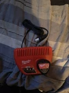 Milwaukee M12 Lithium-ion Battery Charger Red (48-59-2401). Fixed Price $27.99.