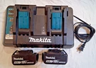 2 Makita BL1850B 5.0AH Batteries W/ DC18RD Dual Port Charger. Fixed Price $160.00.