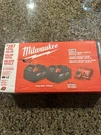 Milwaukee M18 Redlithium XC5.0 18V 5AH Li-ion Kit W/ Charger & 2 Batteries. Fixed Price $205.00.