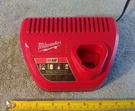 Milwaukee M12 Li-lon Battery Pack Charger. Fixed Price $17.95.