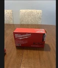 Milwaukee M12 Charger And Battery 50-59-2404 New. Fixed Price $80.00.